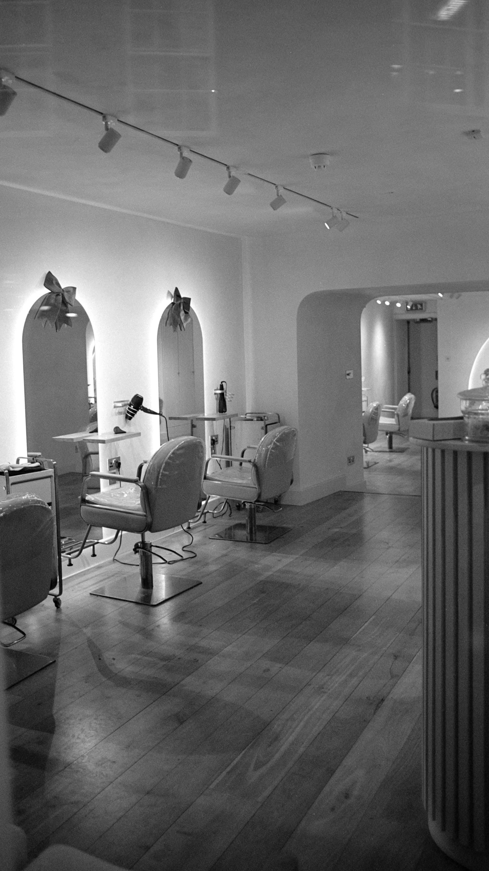 Modern salon interior with styling chairs and mirrors